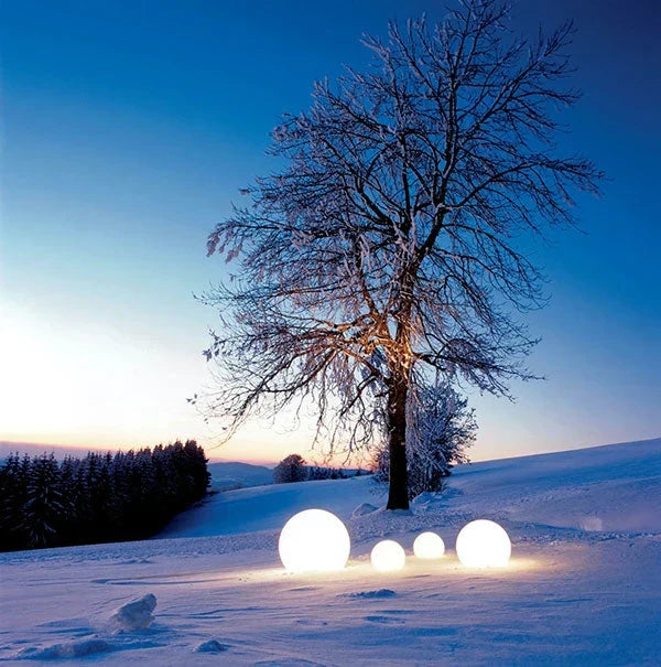 Soft glowing spherical outdoor lamp, GlowSphere LED, perfect for evening garden parties.