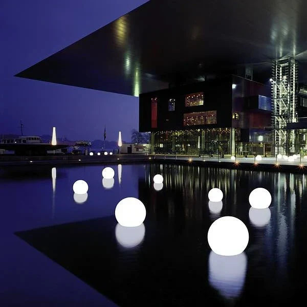 Vibrant color changing GlowSphere spherical garden light, LED, enhances any outdoor patio space.