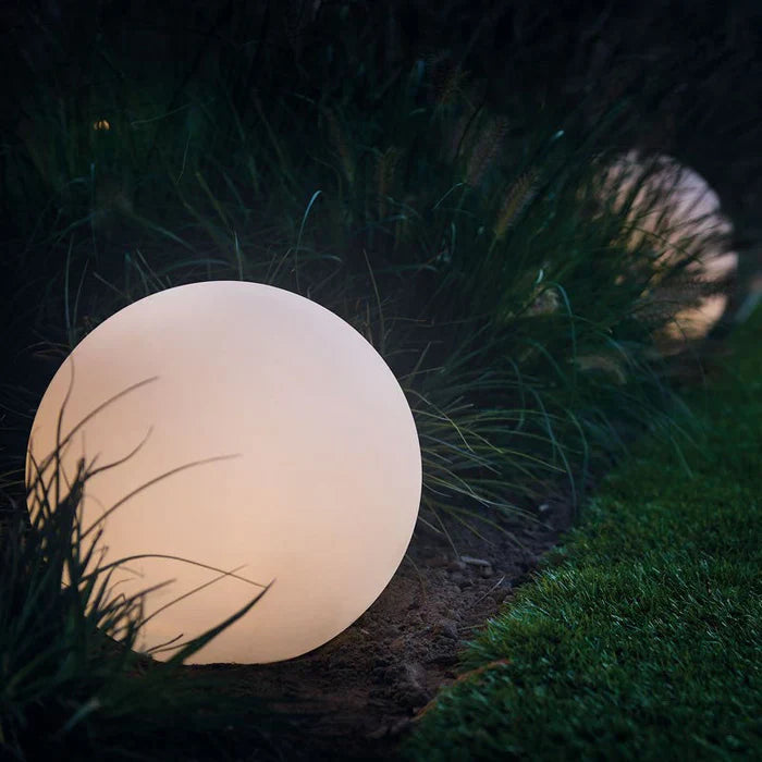 Modern GlowSphere LED spherical garden light, color changing & weather-resistant outdoor decor.