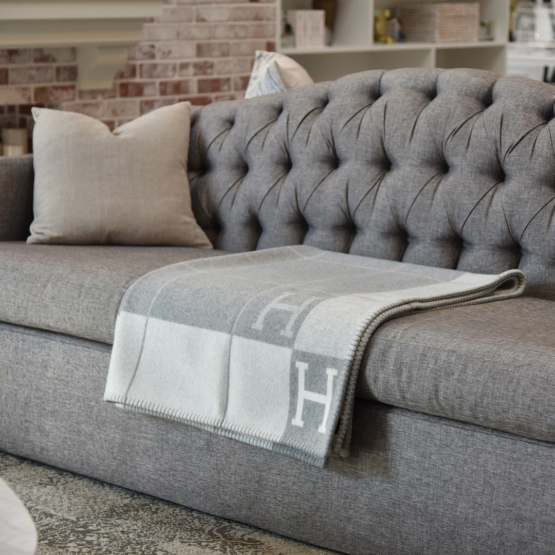 Gold cashmere wool throw blanket for luxury living room decor and cozy comfort.