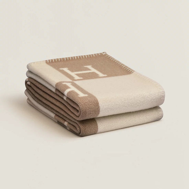 Sophisticated gold throw blanket, cashmere & wool blend for luxurious style.