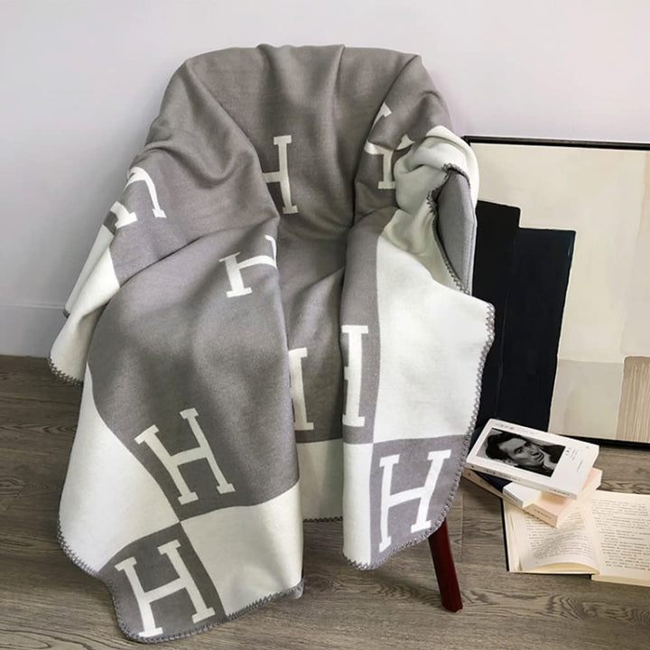 Rich gold cashmere & wool blanket, a luxurious soft accent for your modern home.