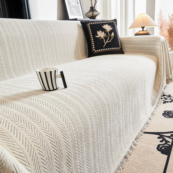 Decorative herringbone chenille throw blanket with tassels. Anti-slip sofa cover, pet-friendly couch protector, washable.