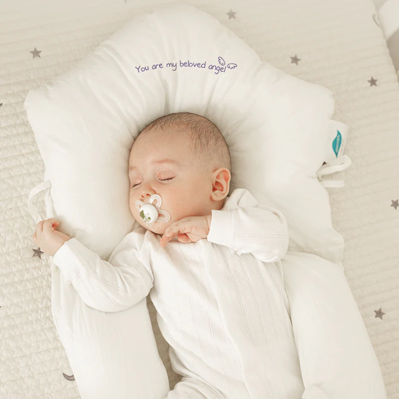 Hypoallergenic infant sleep pillow for safe, gentle support. Perfect for newborns and baby cribs.