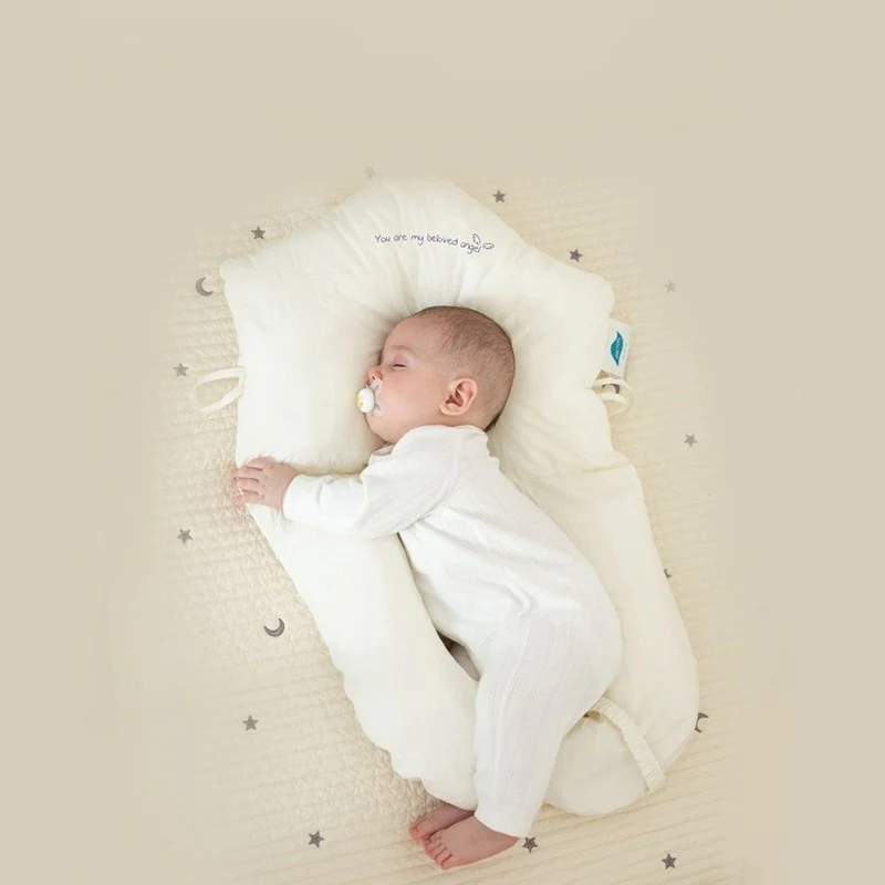 Soft baby sleep pillow providing gentle support for infants & newborns. Essential for safe sleep.