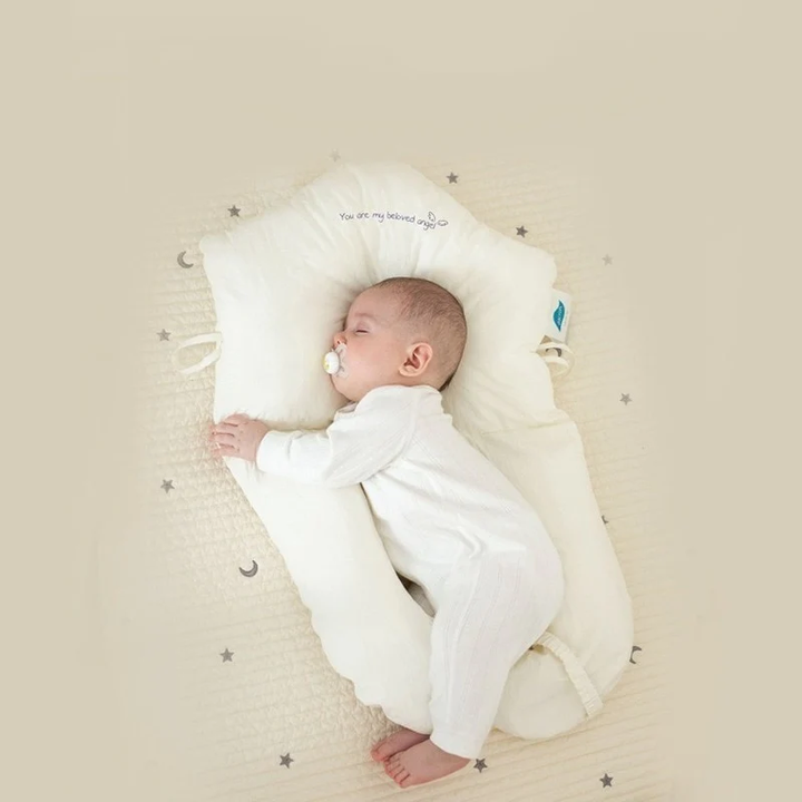 Soft baby sleep pillow providing gentle support for infants & newborns. Essential for safe sleep.