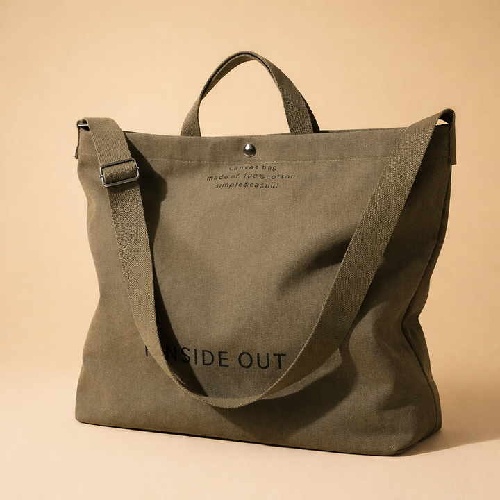 Black modern minimalist women's tote, large capacity everyday handbag, casual shoulder bag style.
