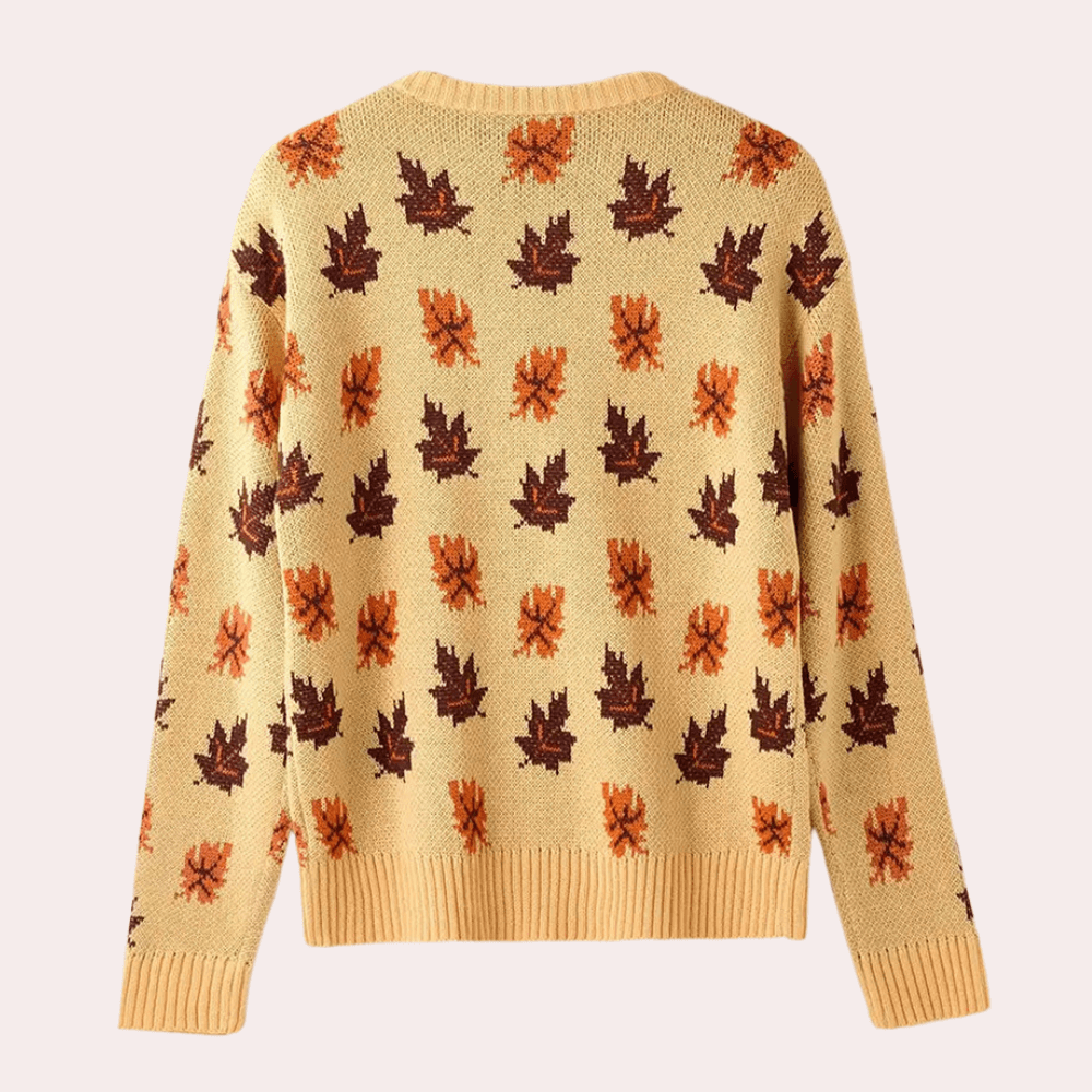 Close-up of the women's knitted leaf pattern on a cozy long sleeve khaki jumper. Ideal for winter casual wear.