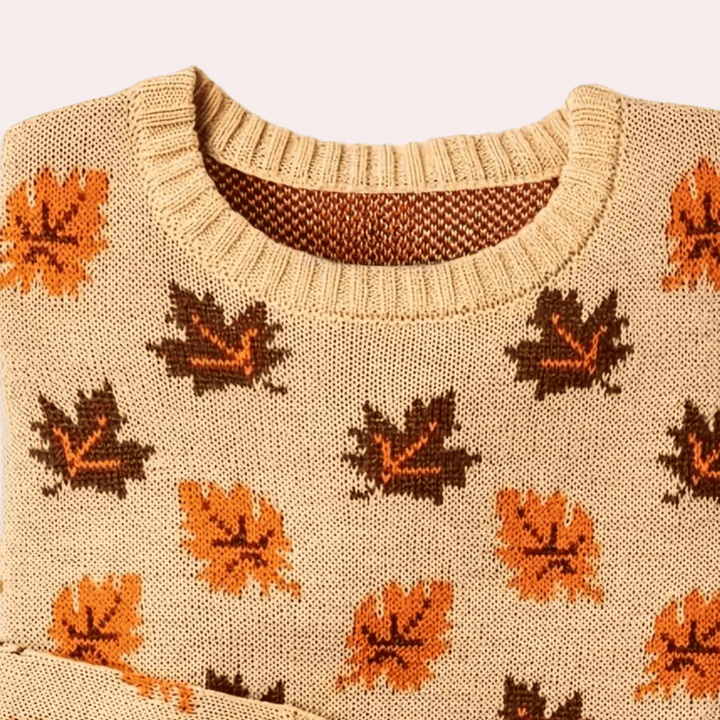 Full view of a women's cozy knitted leaf pattern pullover sweater. Long sleeve, perfect for fall & winter fashion.