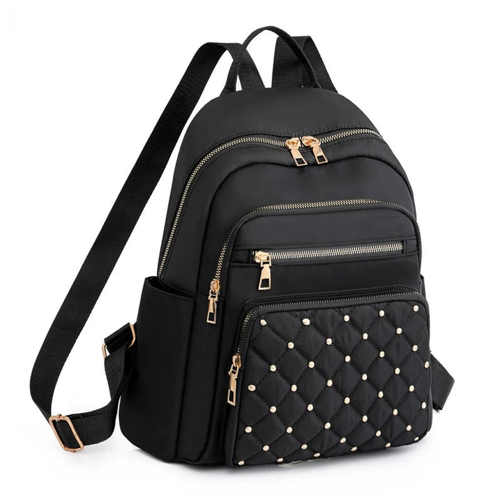 Khaki women's lightweight water-resistant nylon backpack for travel, school & daily use.