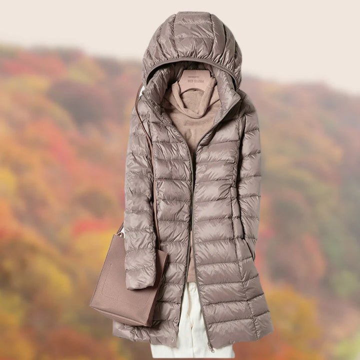 Khaki women's long hooded puffer jacket, warm winter coat for stylish cold weather protection.