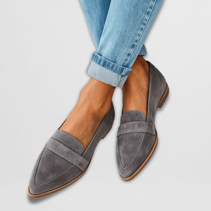 Grey pointed toe women's loafers with penny strap. Versatile slip-on flats perfect for office, casual, or elegant fashion.