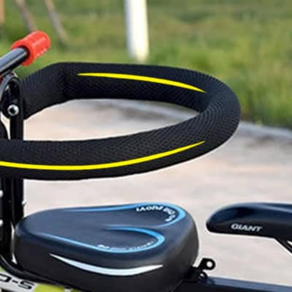 "Kids child bike seat in vibrant red and black with safety harness and padded seat, designed for adult bicycles."