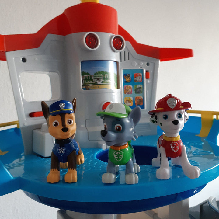 Vibrant plastic kids playset with a multi-level car slide tower, inspiring imaginative play for toddlers and preschoolers.