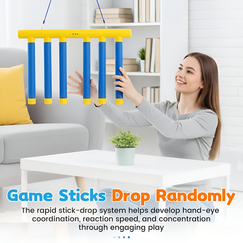 Children playing a falling stick reaction game, enhancing motor skills and concentration.