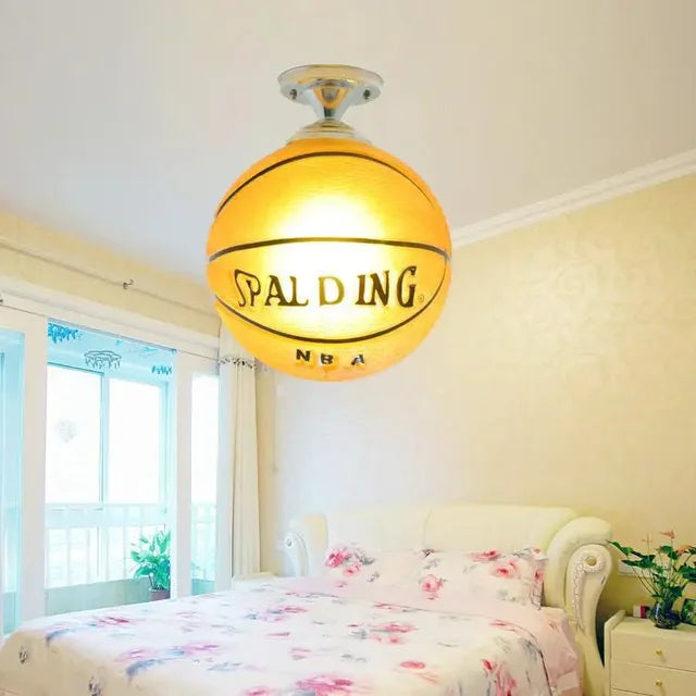 Vibrant sports LED ceiling light for kids' playrooms & bedrooms. Features fun football & basketball.