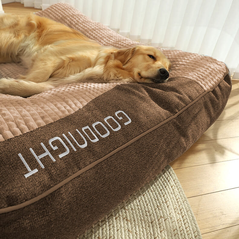 Supportive orthopedic large dog bed with a washable cover and integrated neck bolster.