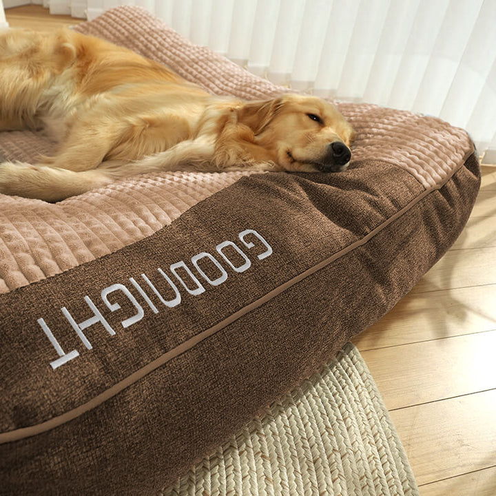 Supportive orthopedic large dog bed with a washable cover and integrated neck bolster.
