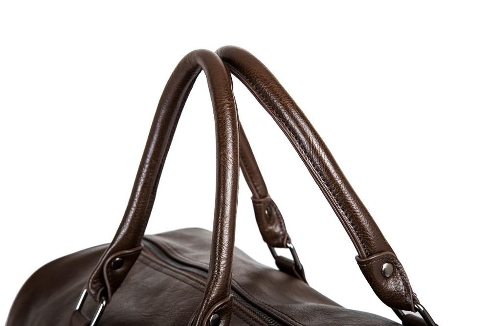 Roomy leather travel duffel, perfect as a lightweight carry-on bag for extended vacations.
