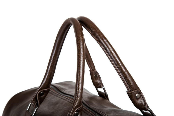 Roomy leather travel duffel, perfect as a lightweight carry-on bag for extended vacations.