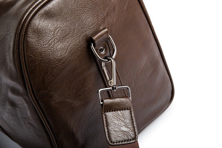 Organize travels with this large, lightweight leather carry-on duffel bag. Unisex & practical.