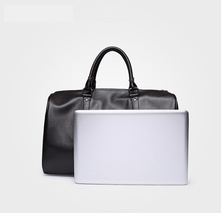 Classic brown leather travel duffel. Large, lightweight carry-on luggage for men & women.