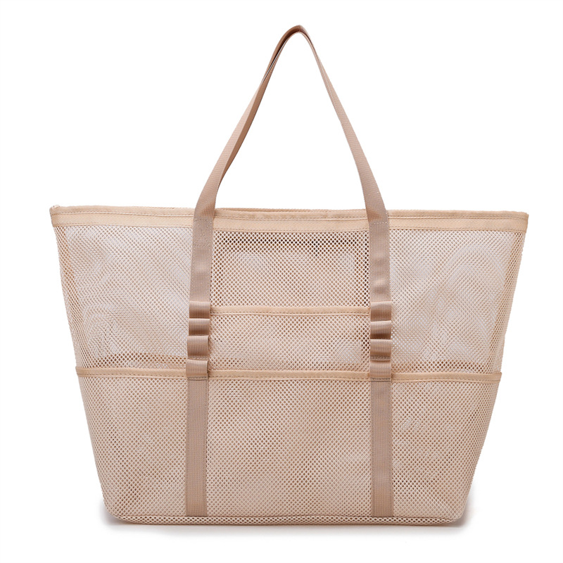 Large women's mesh beach tote bag, perfect for carrying essentials to the beach or pool on summer vacation.