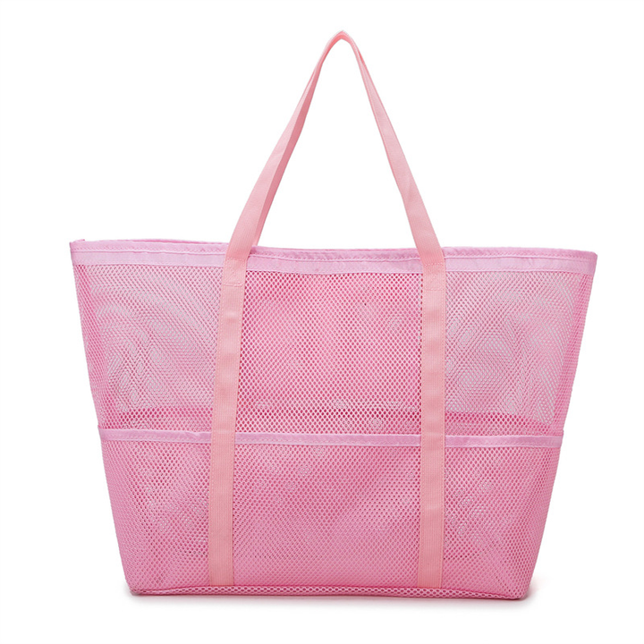 Stylish large mesh beach tote for women, great for towels & toys on a sunny beach day or by the pool.