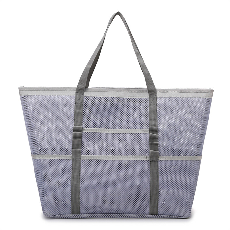 Durable open weave mesh beach tote bag for women, perfect for organizing items on your summer getaway.