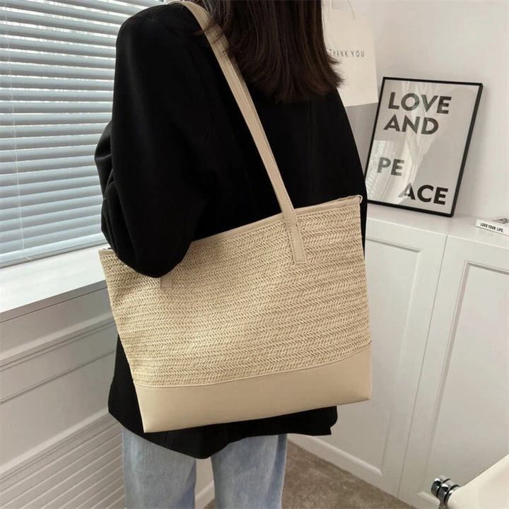 Spacious women's large woven tote bag in beige, designed for carrying everyday essentials and all-season style.