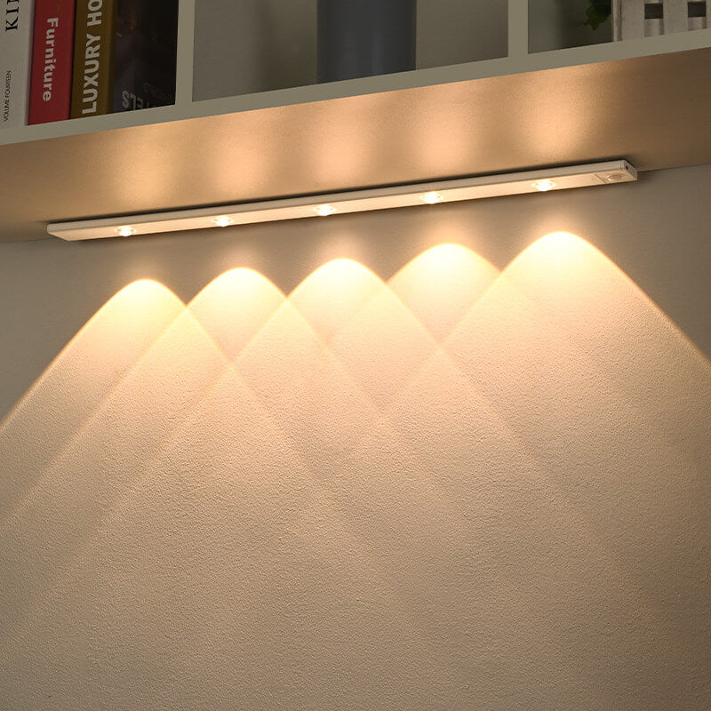 "LED motion sensor under cabinet light with cat-eye bulb, adjustable luminance, and magnetic installation in kitchen setting.