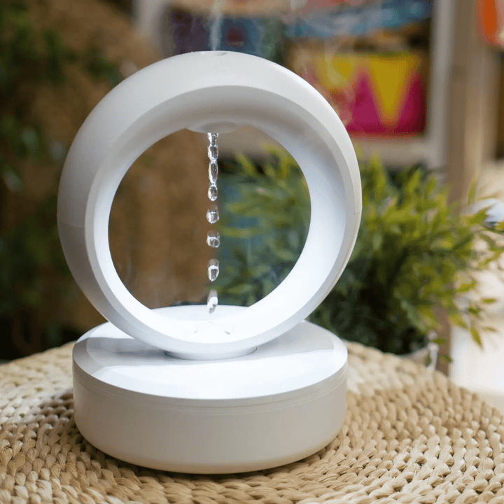 "Levitating Water Droplet Ultrasonic Humidifier with LED light, showing floating droplets effect, perfect for modern decor."