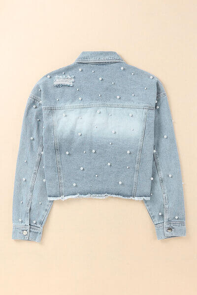 Women's light blue denim jacket, detailed with elegant pearl trim for a unique look.