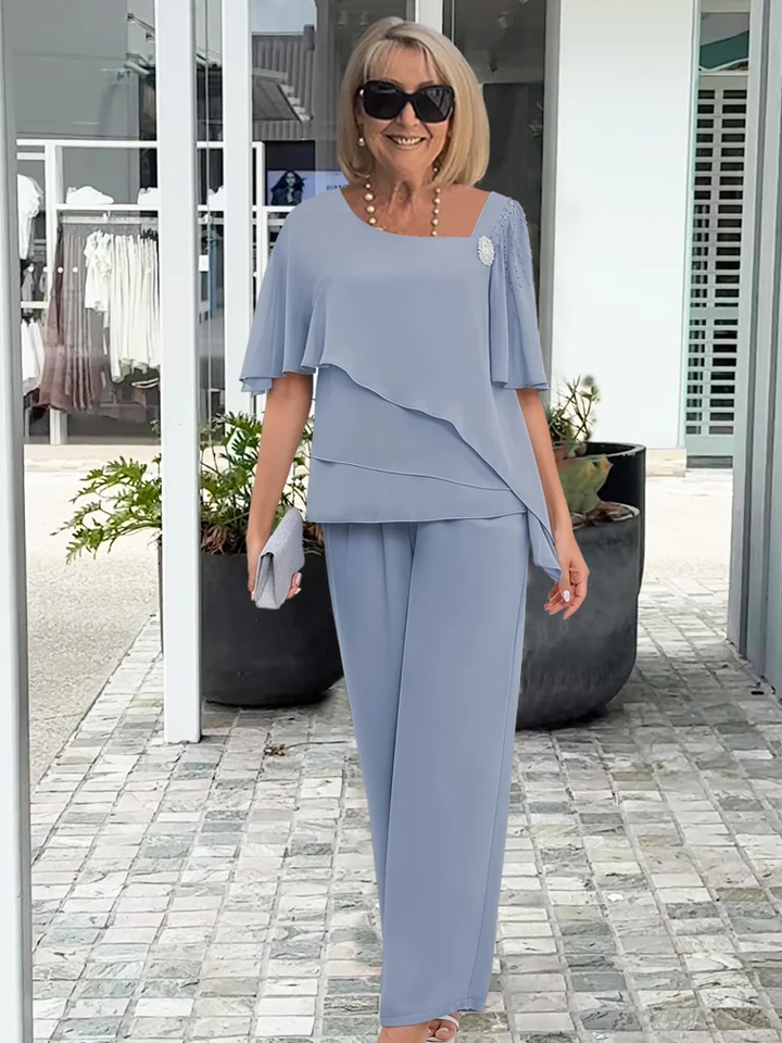 Light blue women's elegant flowy two-piece set, perfect for casual chic summer fashion. Comfortable matching outfit.