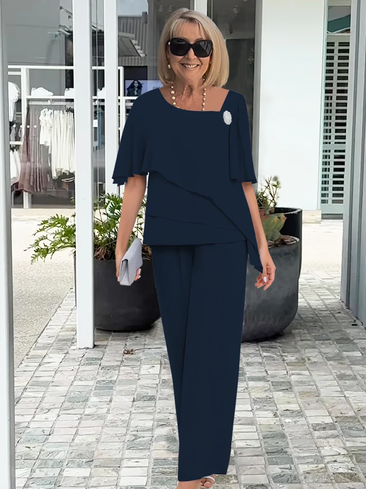 Comfortable navy blue flowy two-piece set for women. Versatile casual chic outfit, ideal for summer elegance.