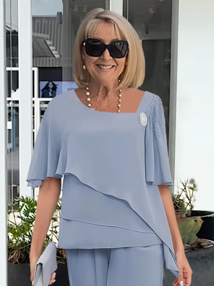 Elegant light blue women's flowy two-piece matching set. Perfect for sophisticated summer fashion and comfort.