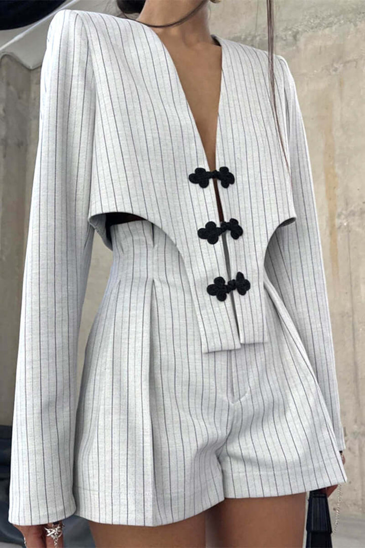 Chic ladies light gray V-neck long sleeve top & striped shorts set. Ideal for casual wear & summer fashion outfits.