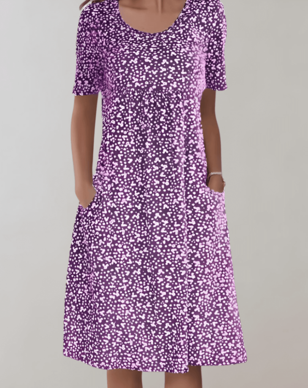 Relaxed fit women's V-neck summer dress. Lightweight, breathable, and comfortable midi length.