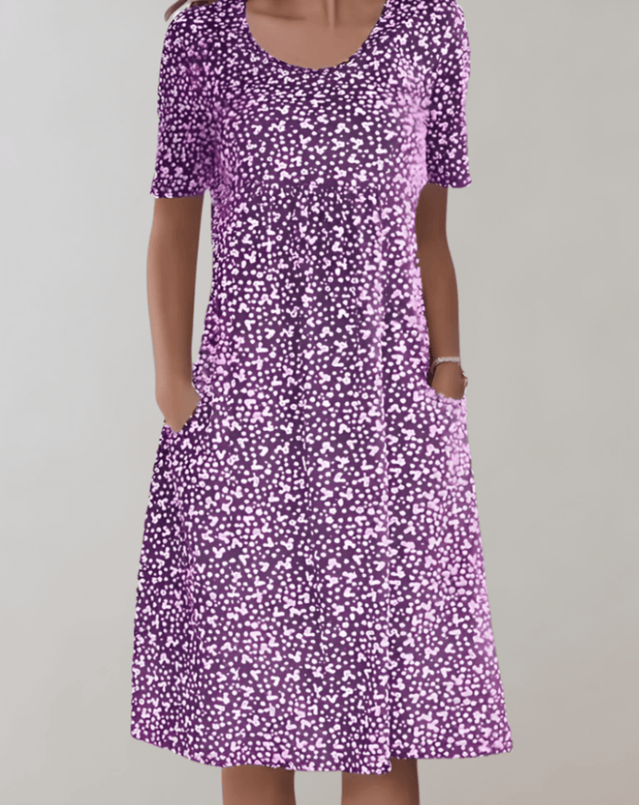 Relaxed fit women's V-neck summer dress. Lightweight, breathable, and comfortable midi length.