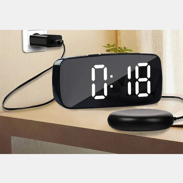Hearing impaired wake-up aid: digital vibrating alarm clock with strong bed shaker and adjustable loud alarm.