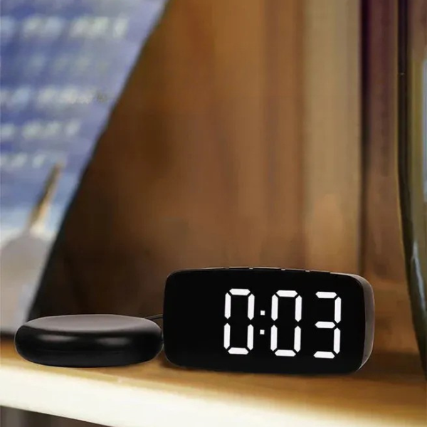 Heavy sleeper's solution: a powerful bed shaker accessory connected to a loud vibrating digital alarm clock.