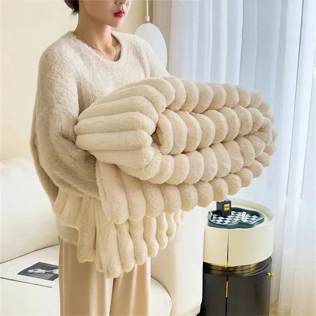 Ultra-soft luxury plush blanket, perfect for cozy relaxation, adding comfort to any home decor.