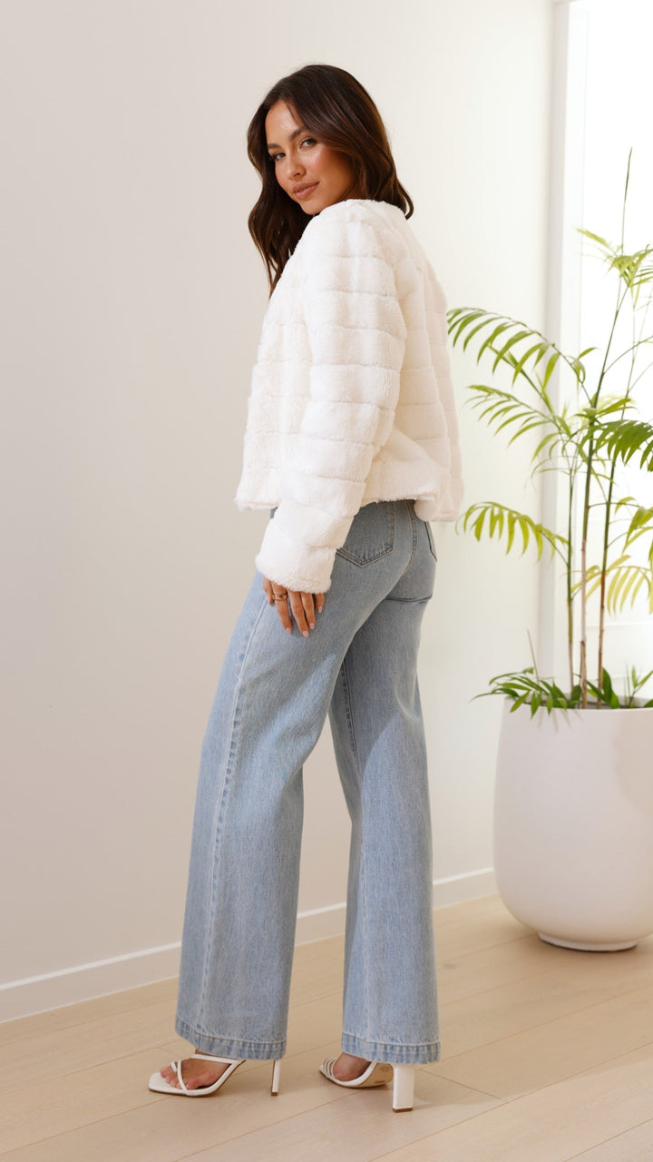 Modern women's luxe veloura crop jacket, perfect for a statement outfit.