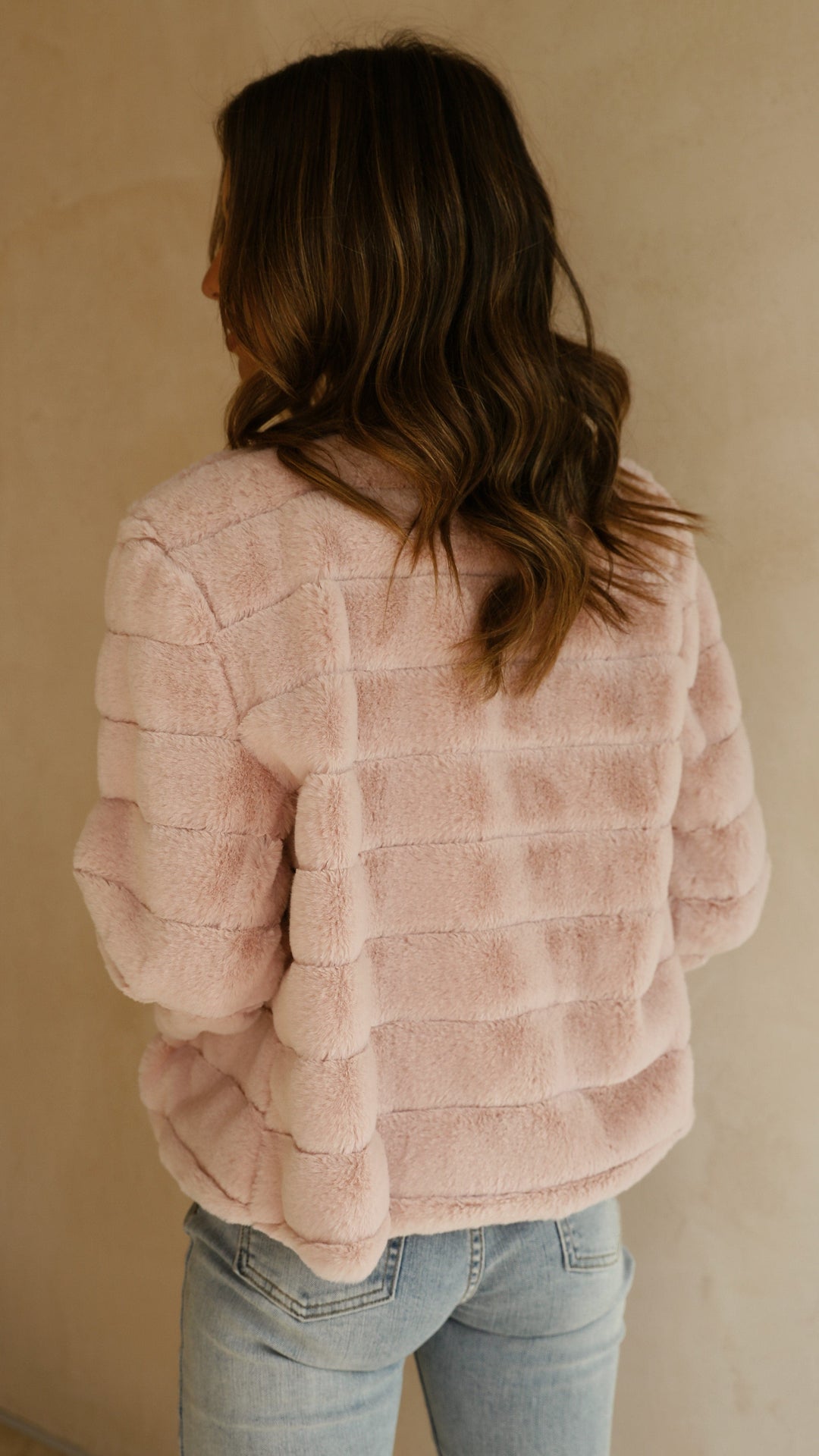 Plush women's cropped jacket in veloura, a luxurious and stylish fashion piece.