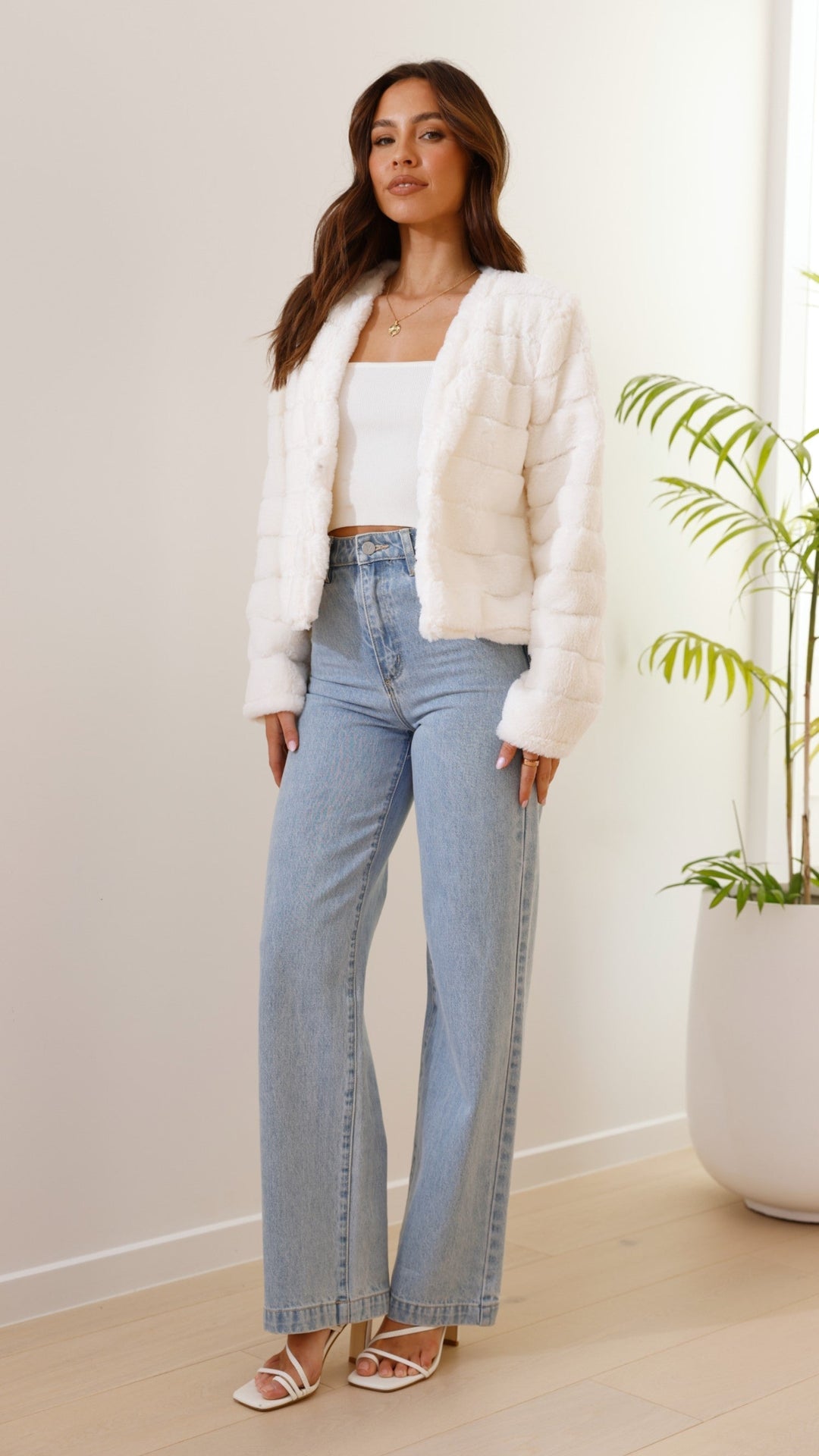 Elegant women's luxe cropped veloura jacket, a fashionable statement piece.