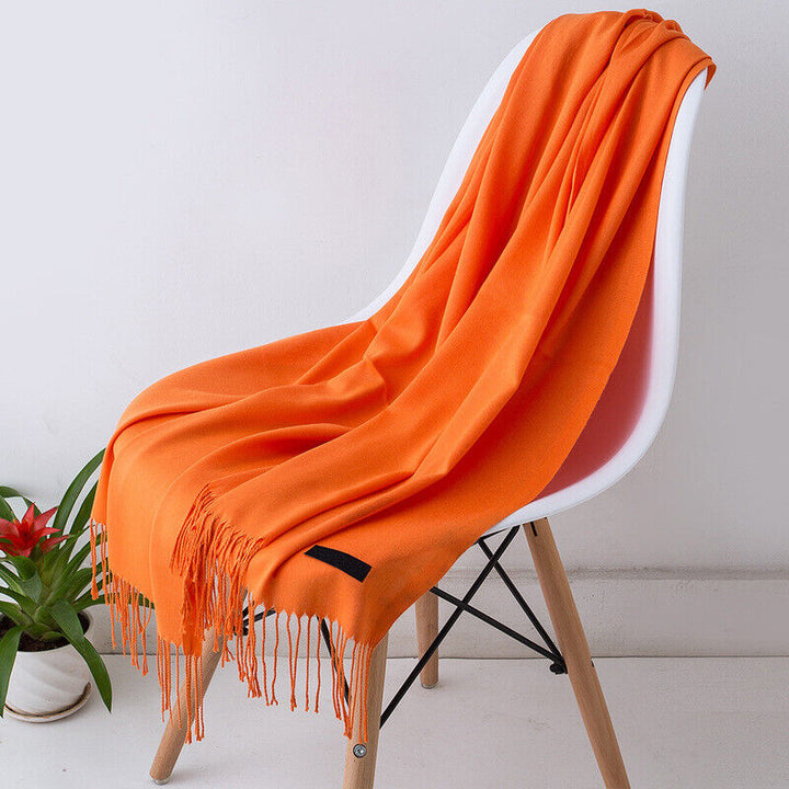 Versatile women's long cashmere scarf, soft, warm, and stylish for a luxurious winter look.