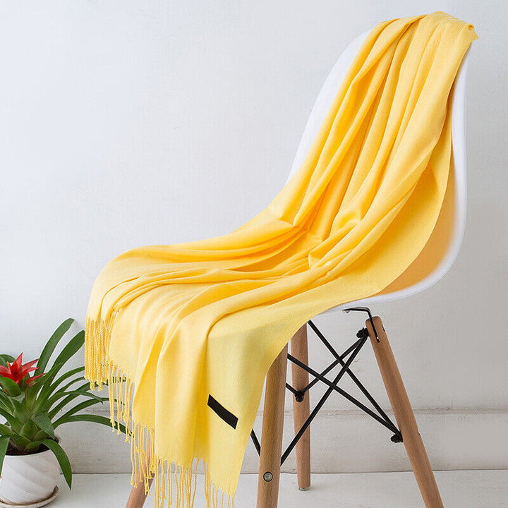 Plush long women's cashmere scarf, soft, warm, and luxurious, perfect for winter fashion.
