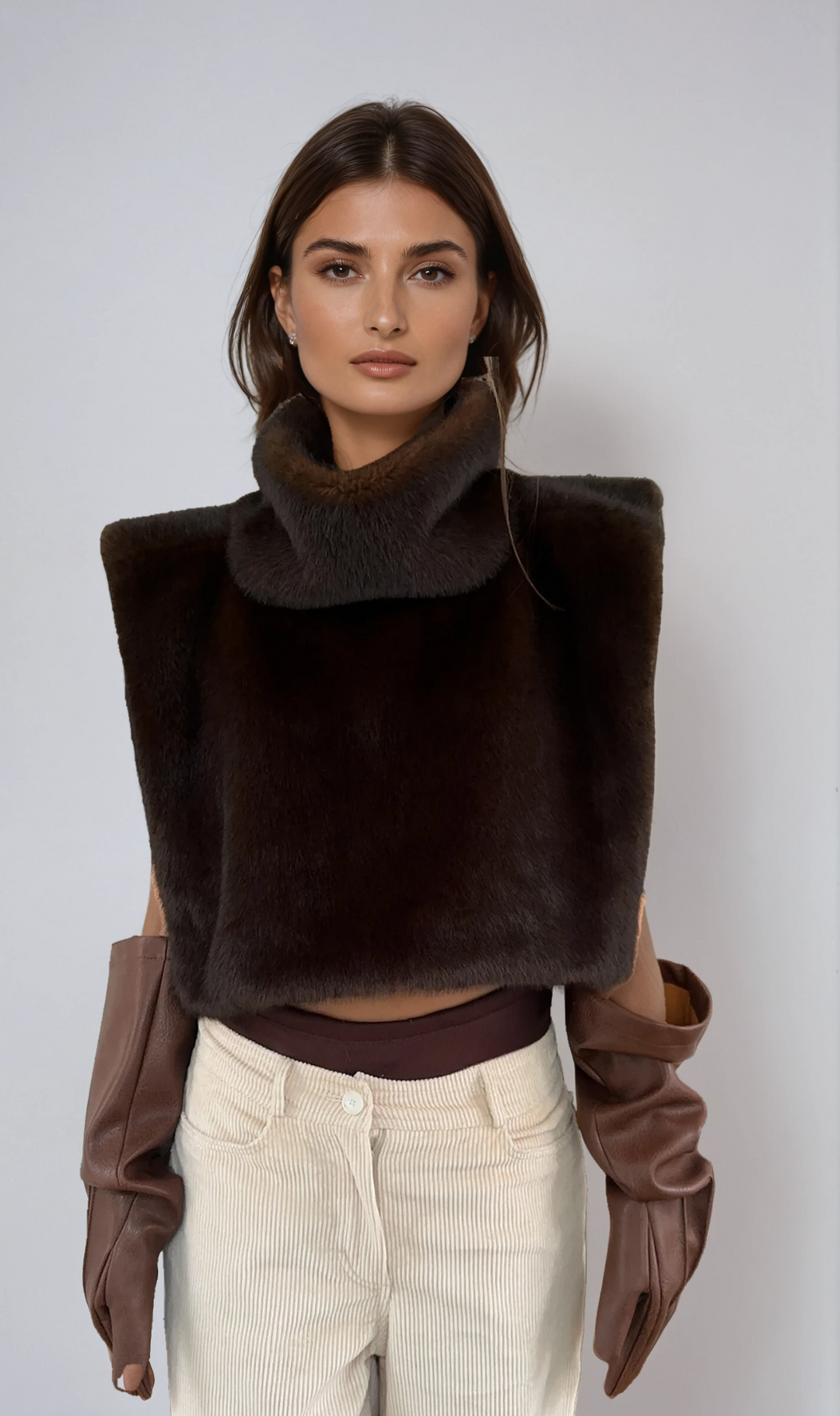 Luxurious dark brown faux fur turtleneck vest for women, perfect for winter style and warmth.