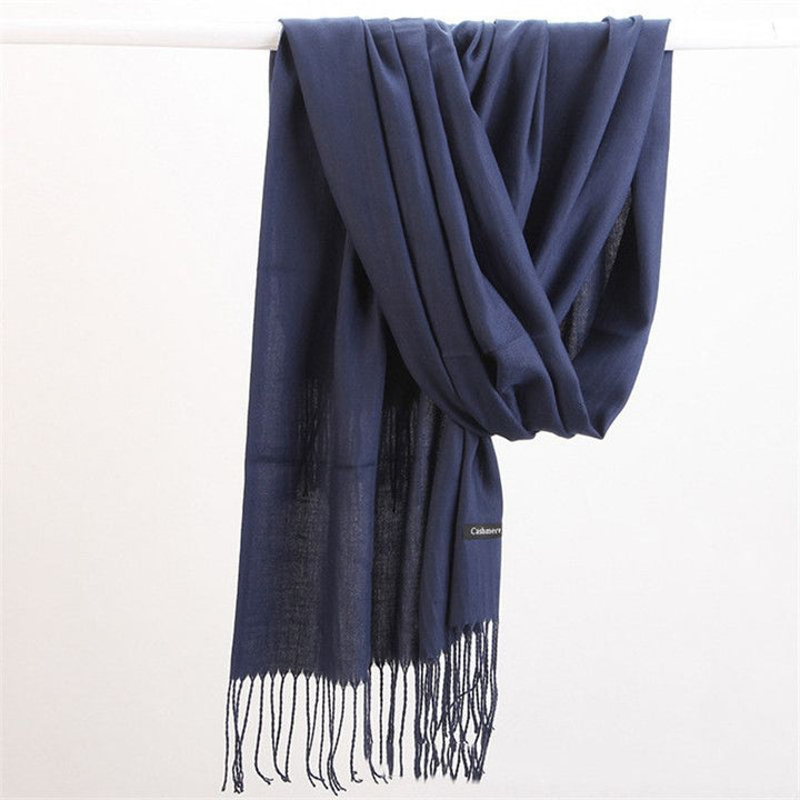 Chic women's cashmere scarf, a high-quality accessory for elegant cold weather fashion.