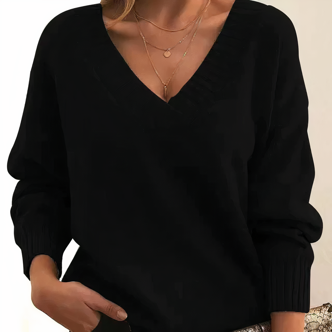 Luxurious Isabella women's cashmere V-neck knit sweater, soft & elegant for cozy fall/winter comfort.